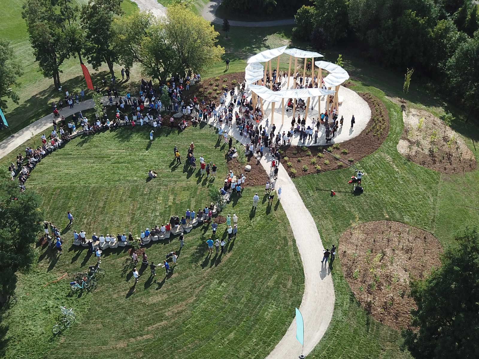 an aerial view of a group of people standing in a circle.